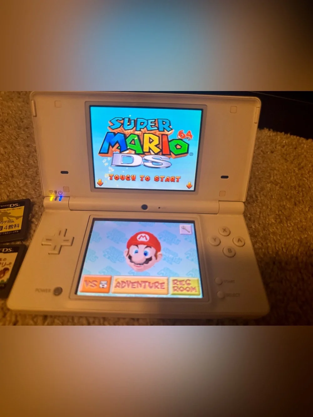 Nintendo DSI White Dual-Screen Handheld with 4 DS Game Cartridges - Japanese